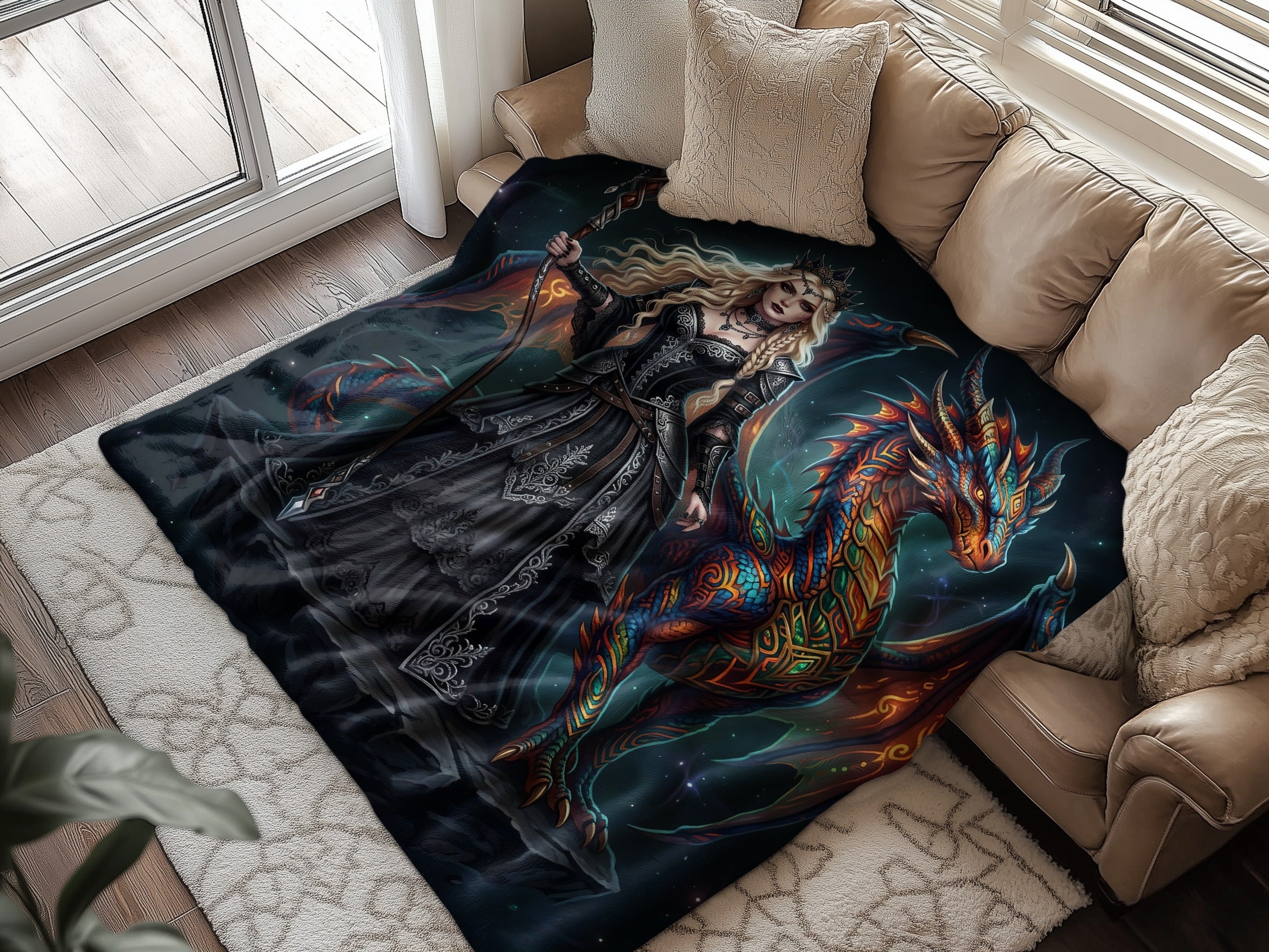 Fantasy queen with dragon illustration on a dark patterned blanket.