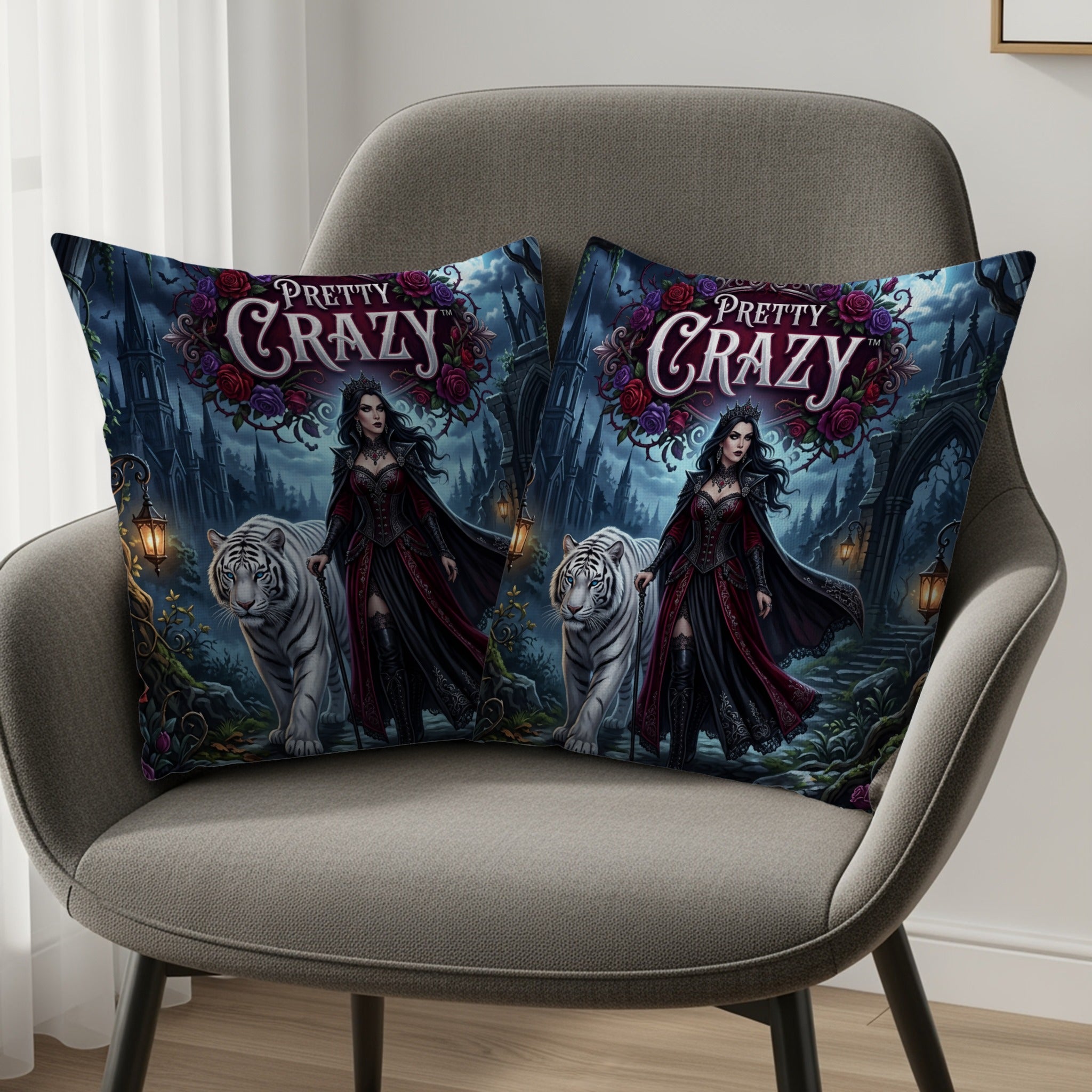 Two throw pillows with gothic art of a woman and white tigers on a throne.